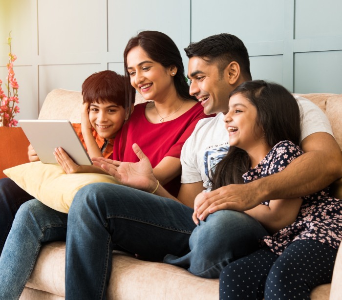 family looking at a tablet together
